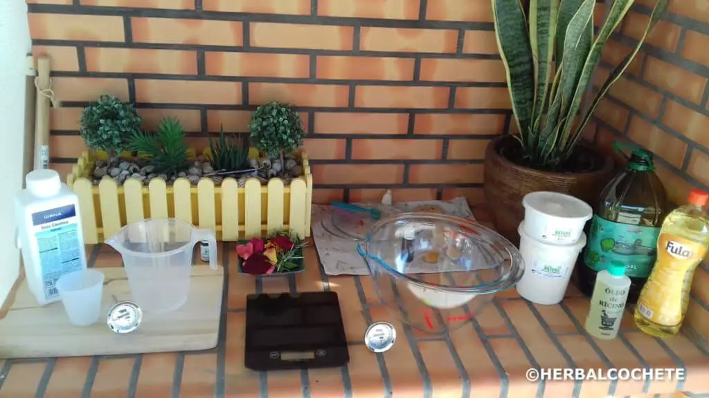 outdoor counter with organized soap ingredients and equipment