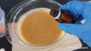 Pouring essential oils into soap batter
