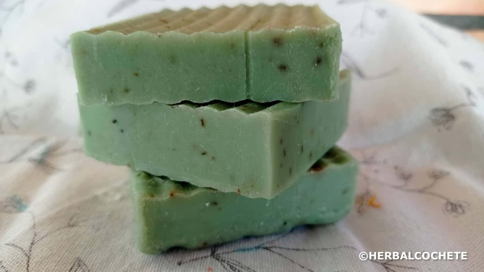 Three green soap bars scented with rosemary and eucalyptus
