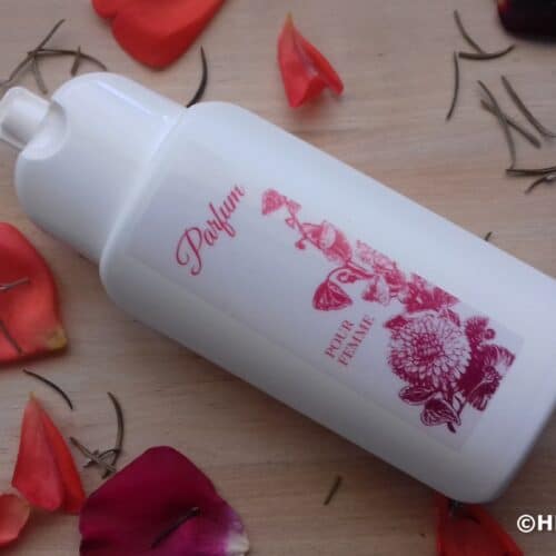 White bottle with homemade body lotion with rose water