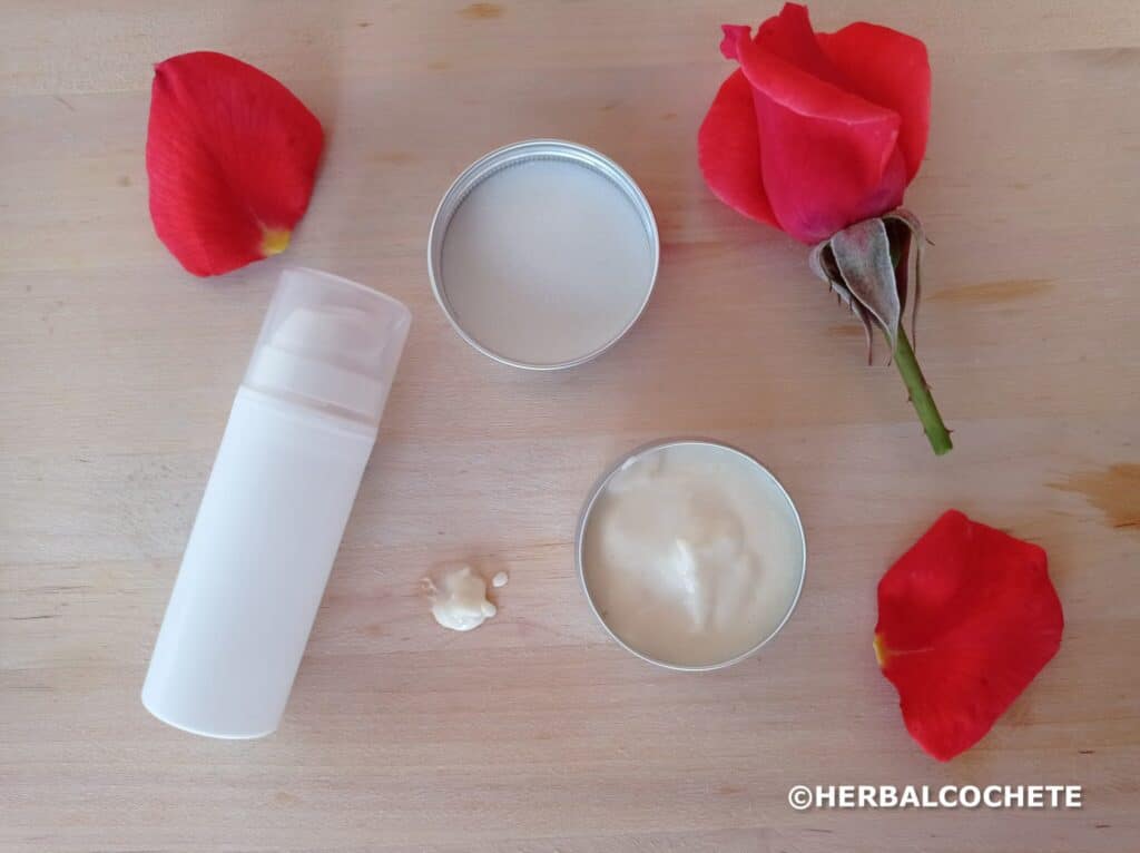 airless bottle and cosmetic tin can with homemade face lotion, decorated with rose petals