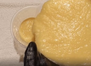 Pouring patchouli soap batter into pitcher