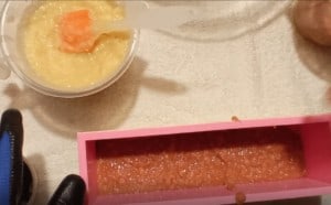 Adding red layer of soap into mold