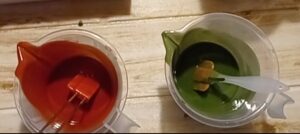 red and green soap pitchers